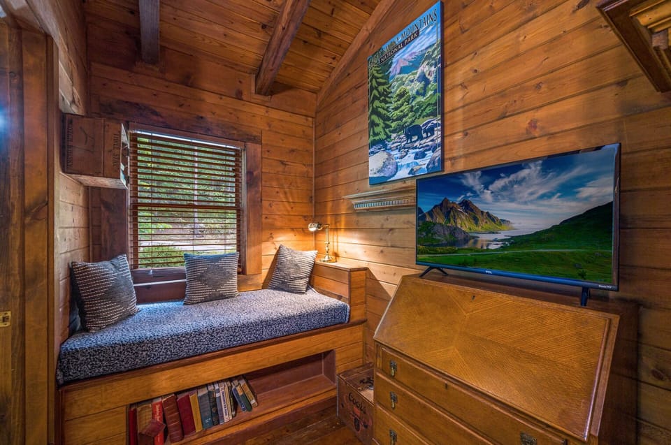 Cozy up and watch a movie, in this cozy nook in the upstairs bedroom.
