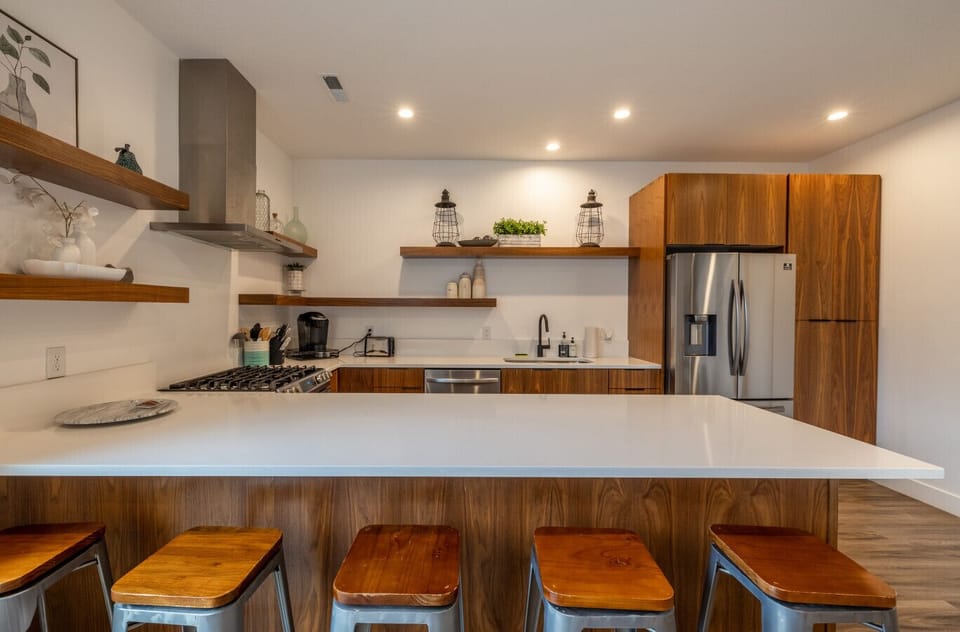 Spacious kitchen with bar seating, perfect for meals or evening drinks
