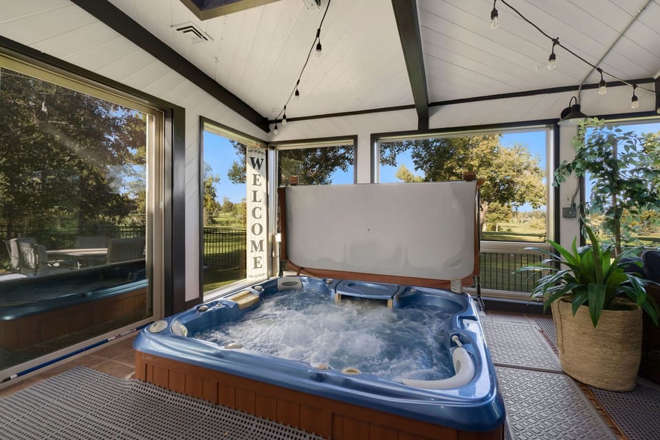 Soak in the relaxing hot tub in the pool room!