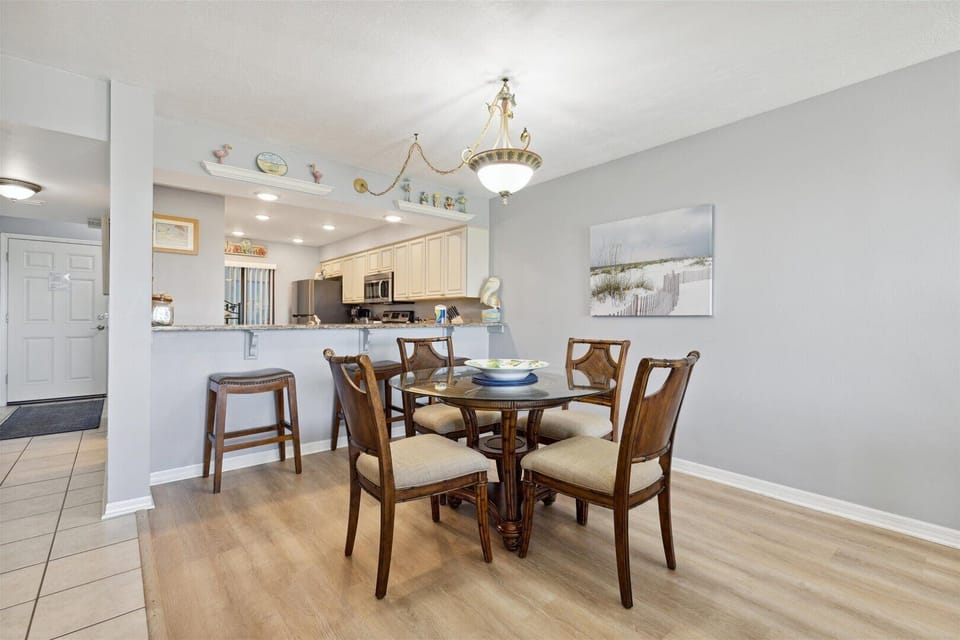 A charming dining nook for breakfasts, family-style dinners, or evening card games after a beach-filled day.
