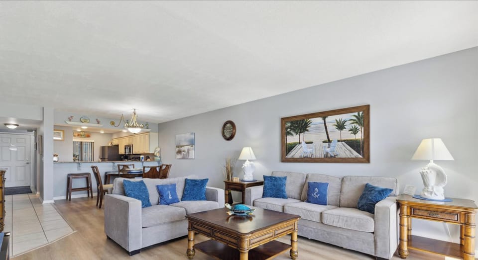 A bright and spacious living room that opens into dining and kitchen spaces—perfect for gathering and entertaining.