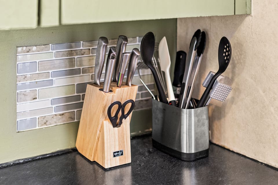Kitchen is stocked with all of your standard kitchen utensils and tools.