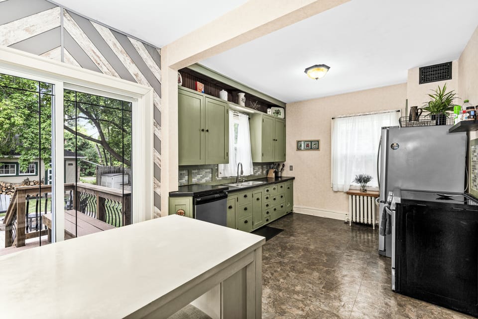 Bright kitchen with an island and room for more than one cook.
