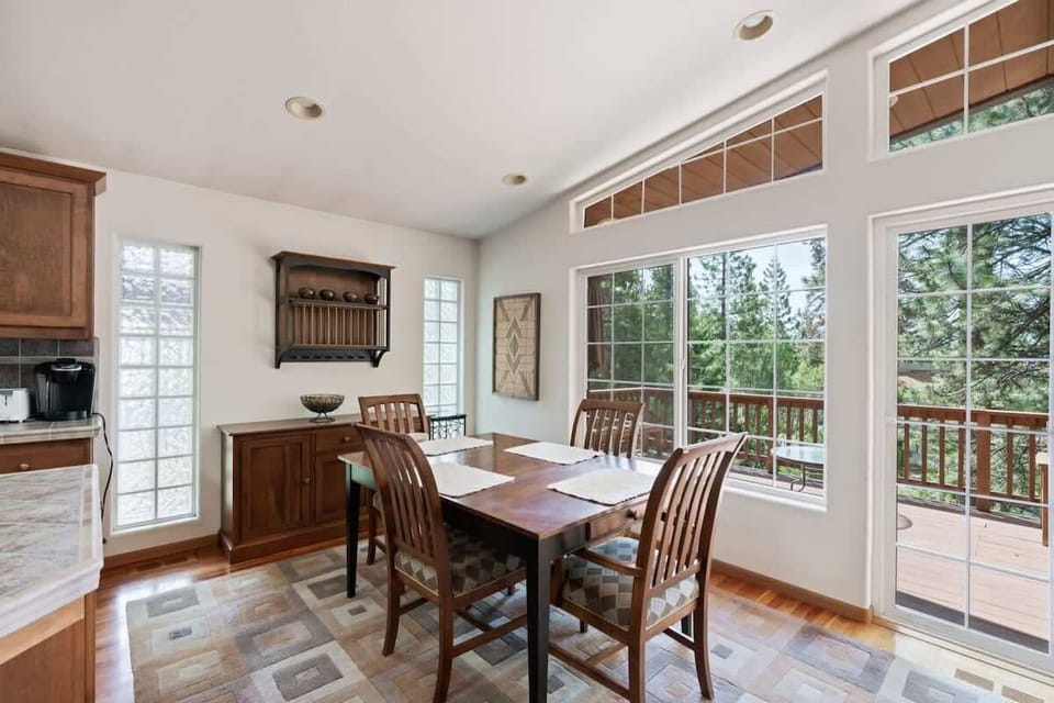 Enjoy a meal in the dining area where you will find a dining table with seating for 4 tucked next to the large windows.