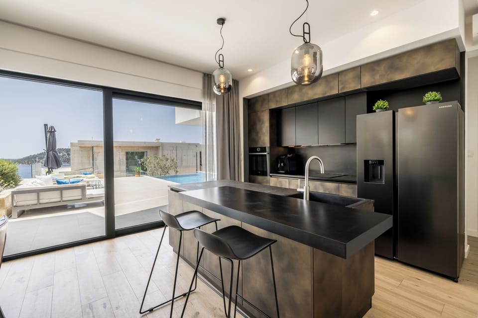 Villa | Private kitchen | Full-size fridge, microwave, oven, dishwasher