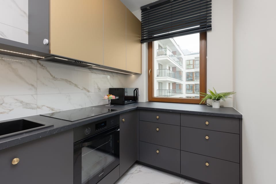 The functional kitchenette space has high-quality appliances.