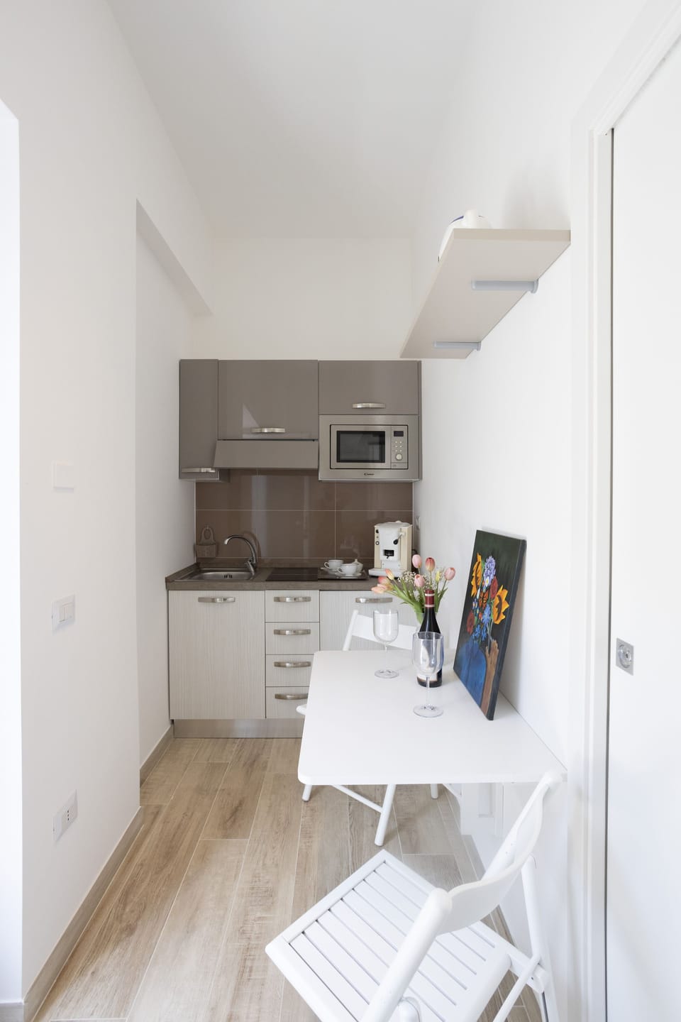 Comfort Studio | Desk, laptop workspace, blackout drapes, iron/ironing board
