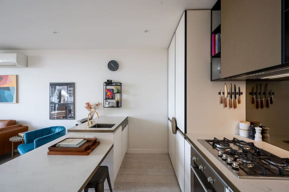 Fully equipped kitchen with gas cooking appliances and plenty of cooking utensils for the times you just want to stay in.