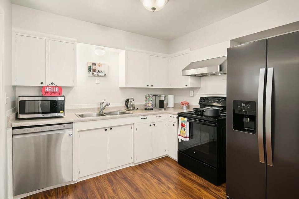 Cook, brew coffee, or clean up easily in this fully stocked kitchen—from a fridge with water dispenser to a dishwasher, it’s designed for hassle-free stays.