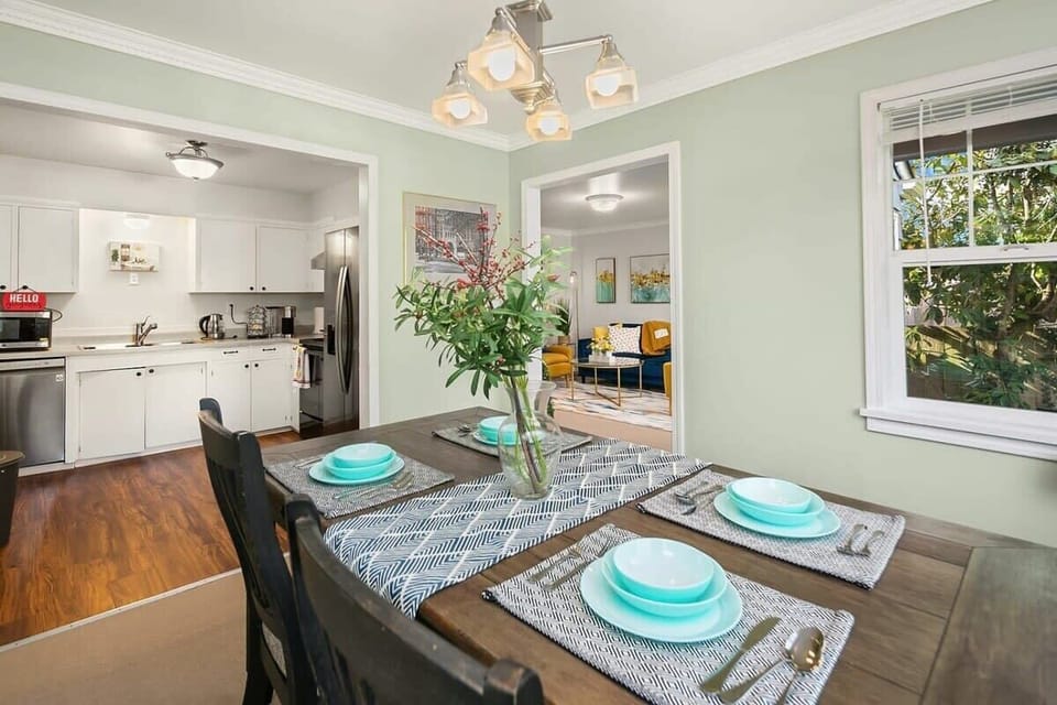 Enjoy meals at this sunlit table, with a clear view of the living room—ideal for easy, connected gatherings.