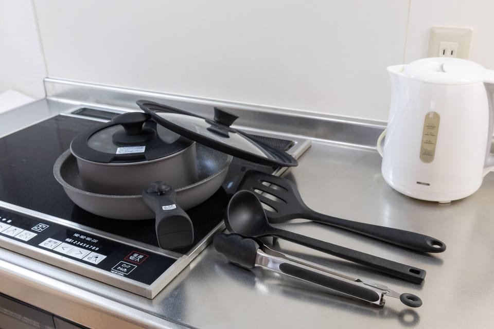 City Apartment | Private kitchen | Full-size fridge, microwave, cookware/dishes/utensils, cleaning supplies