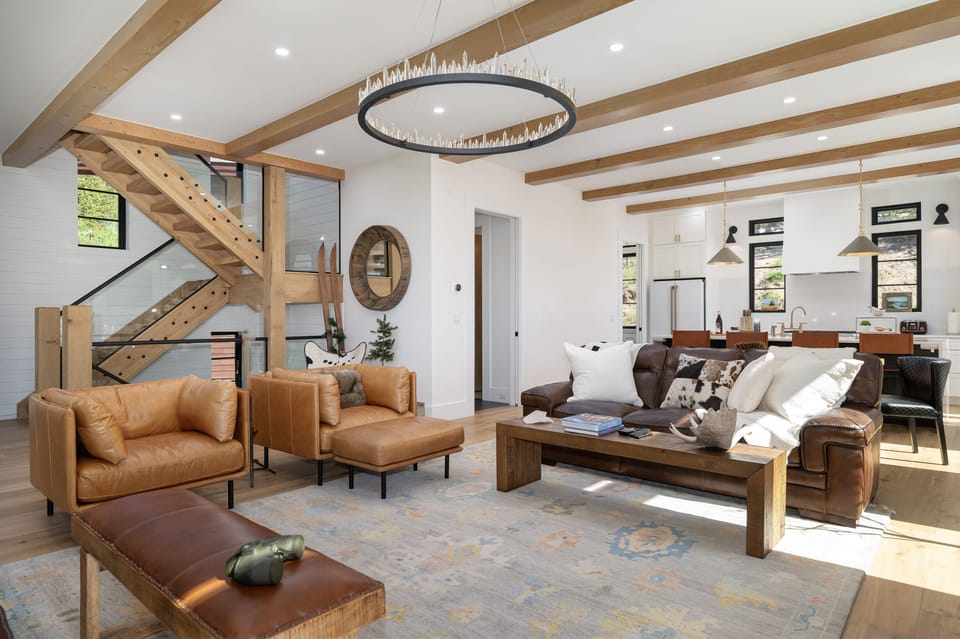 Come relax in the modern living room, where there’s plenty of space to unwind and cozy seating all around.
