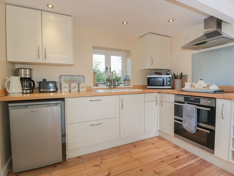 Fridge, electric kettle, toaster, cookware/dishes/utensils