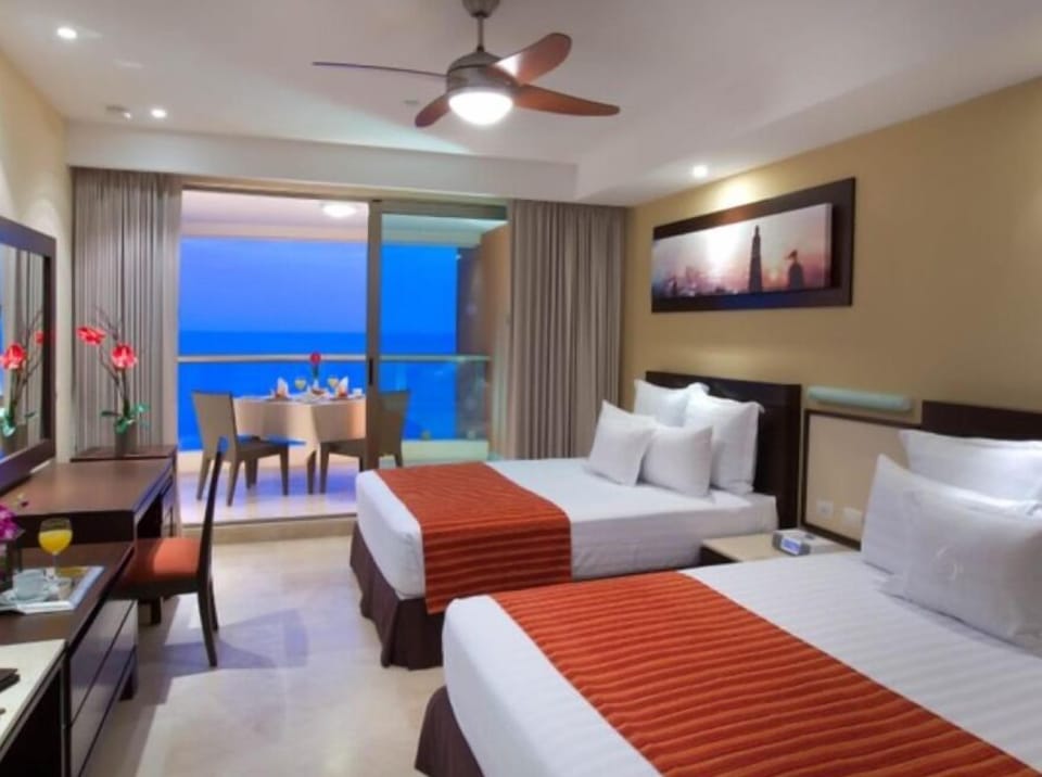 Two queen beds and balcony.