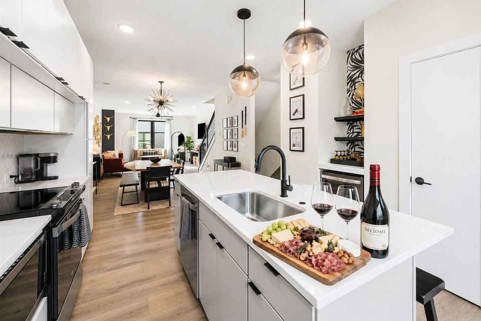 A beautifully designed kitchen featuring chef-grade appliances, quartz countertops, and elevated finishes—perfect for everything from morning coffee to evening wine and charcuterie.