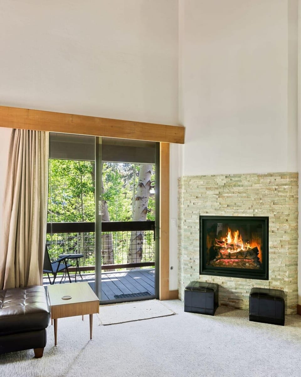 Warm up by the lovely fireplace and enjoy a movie night in the cozy living room.