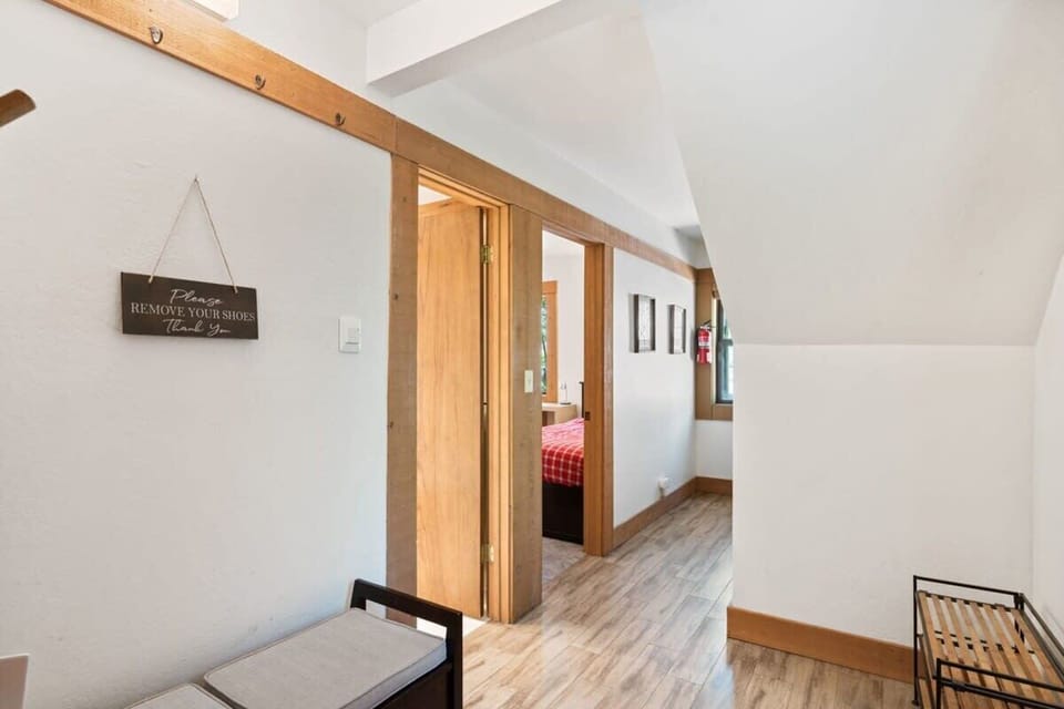 The view of the entryway of the home on the lower level where you will also find two bedrooms and two bathrooms.