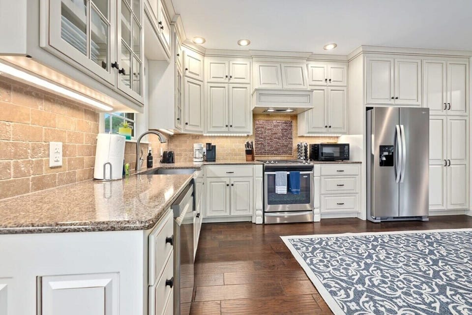 Our kitchen has a large island with four barstools as well as state-of-the-art appliances and all the essentials you need to create your favorite meal.