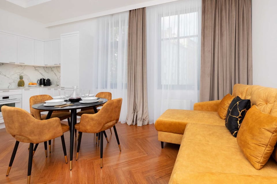 A wide view of the open-plan living and dining area, combining stylish decor with functional design.
