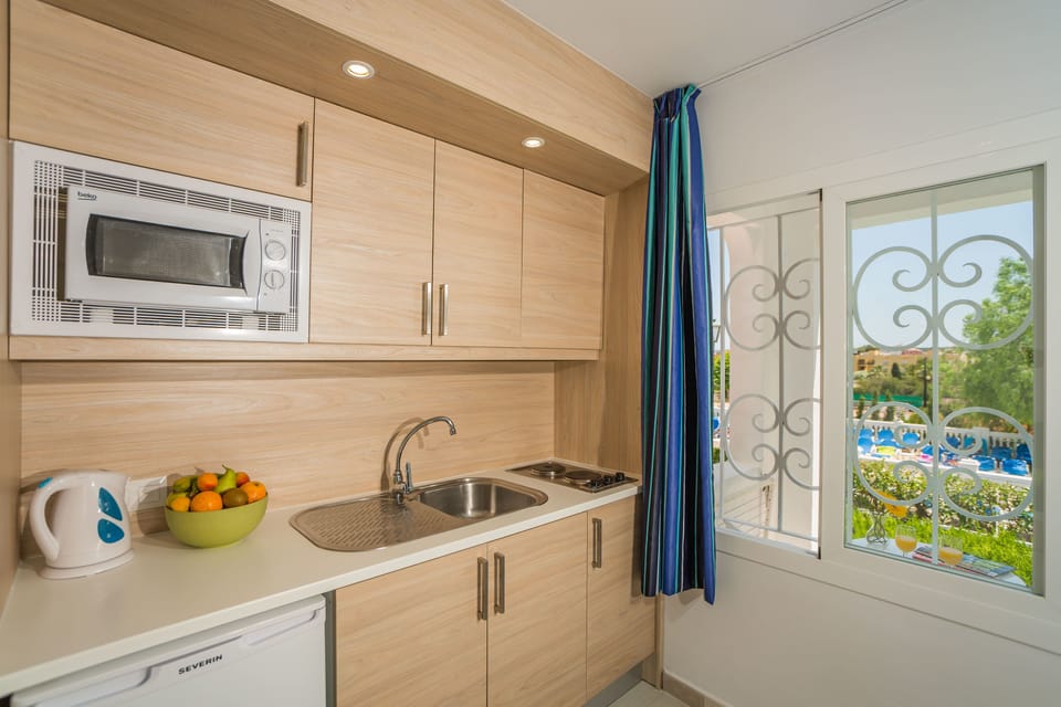 Family Apartment, 1 Bedroom, Balcony | Private kitchen | Fridge, microwave, stovetop, coffee/tea maker