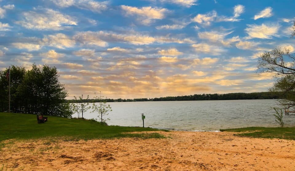 Sandy beach just a short walk away, perfect for swimming, relaxing, and family lake days.