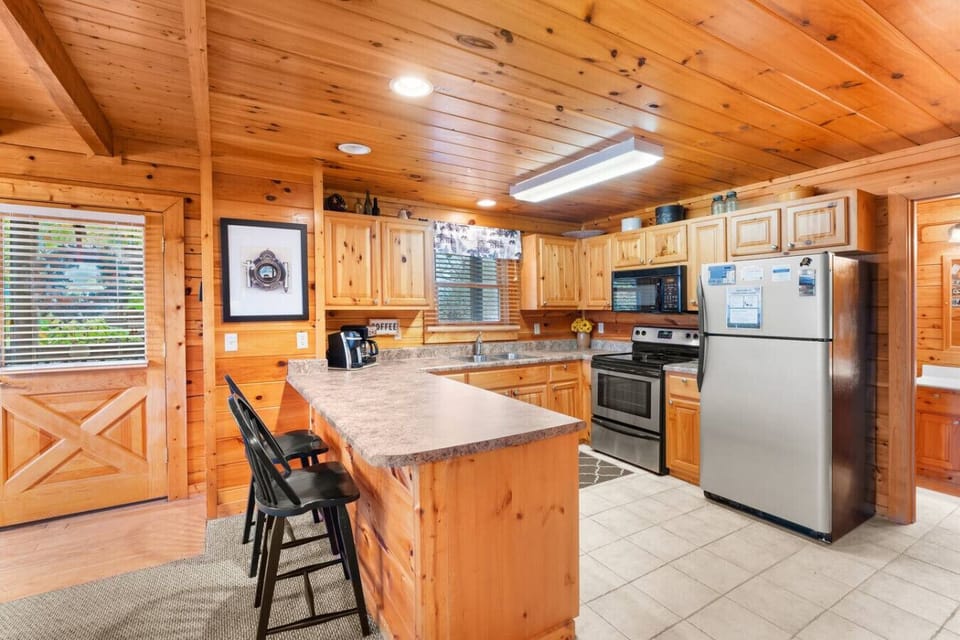 Full-sized kitchen with a suite of stainless steel appliances.