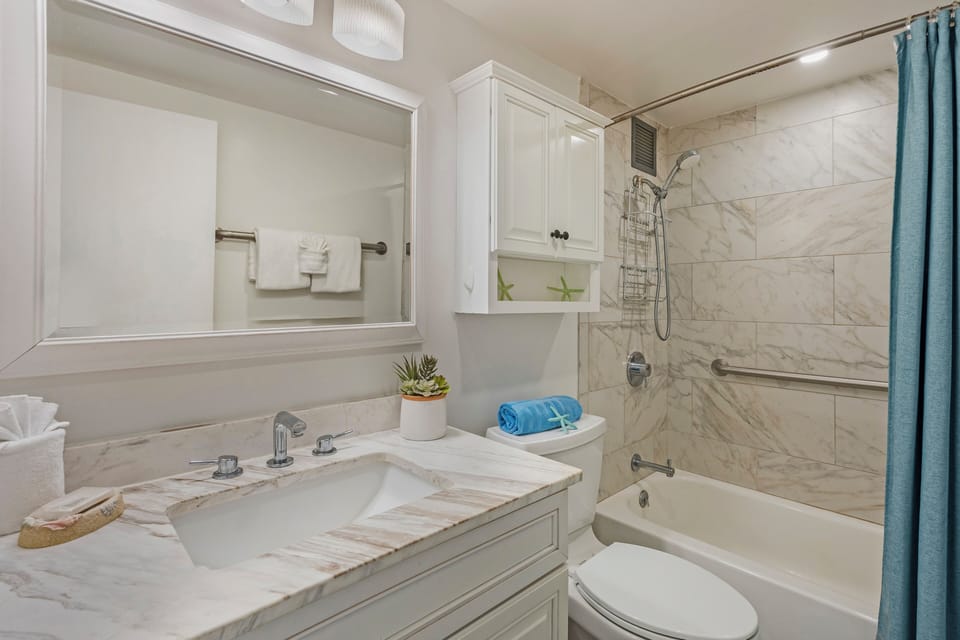 Refresh in this spa like bathroom featuring sleek finishes