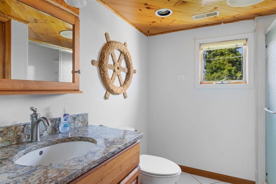 A 2nd Full Bath is located upstairs.