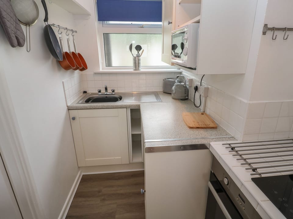 Fridge, electric kettle, toaster, cookware/dishes/utensils