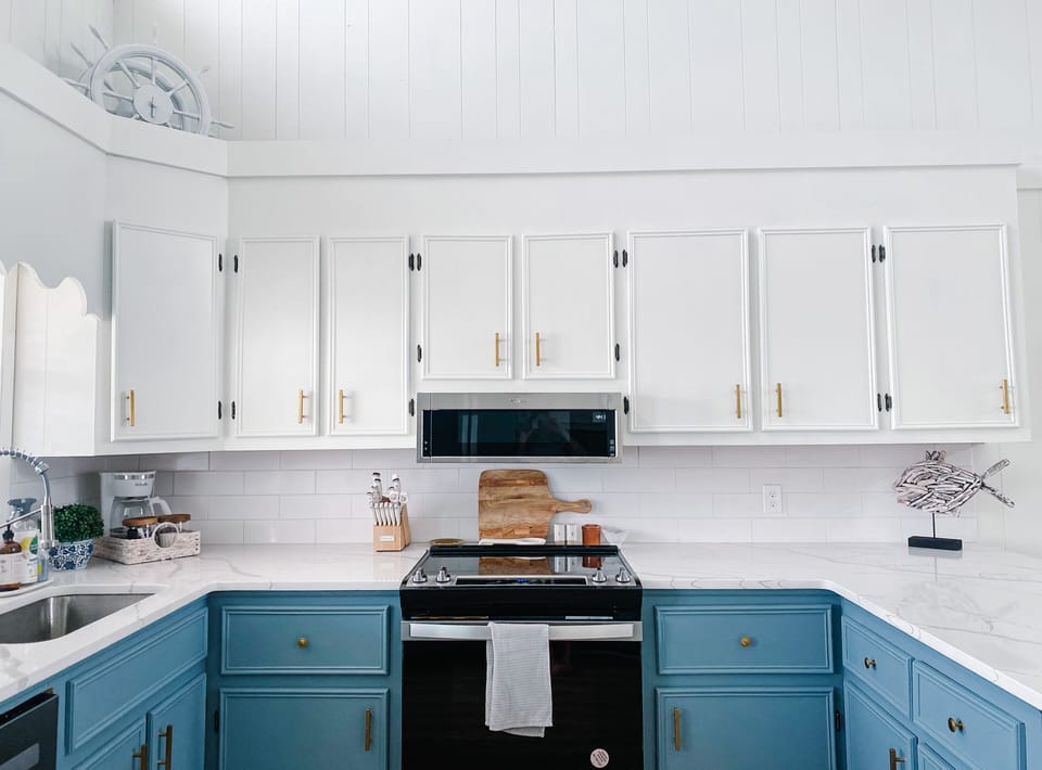 Updated kitchen with quartz countertops and new appliances.