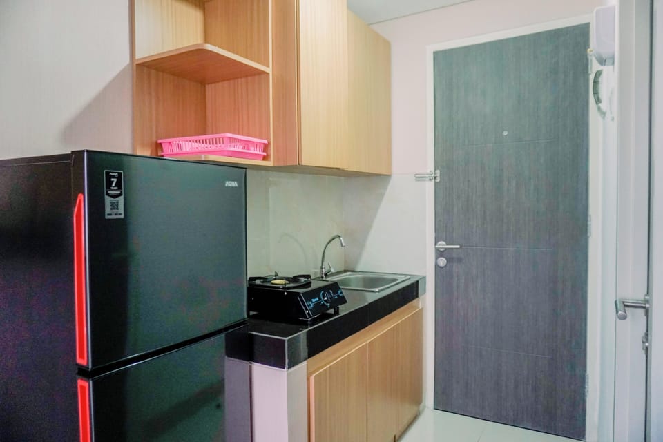 Full-size fridge, stovetop, rice cooker, cookware/dishes/utensils