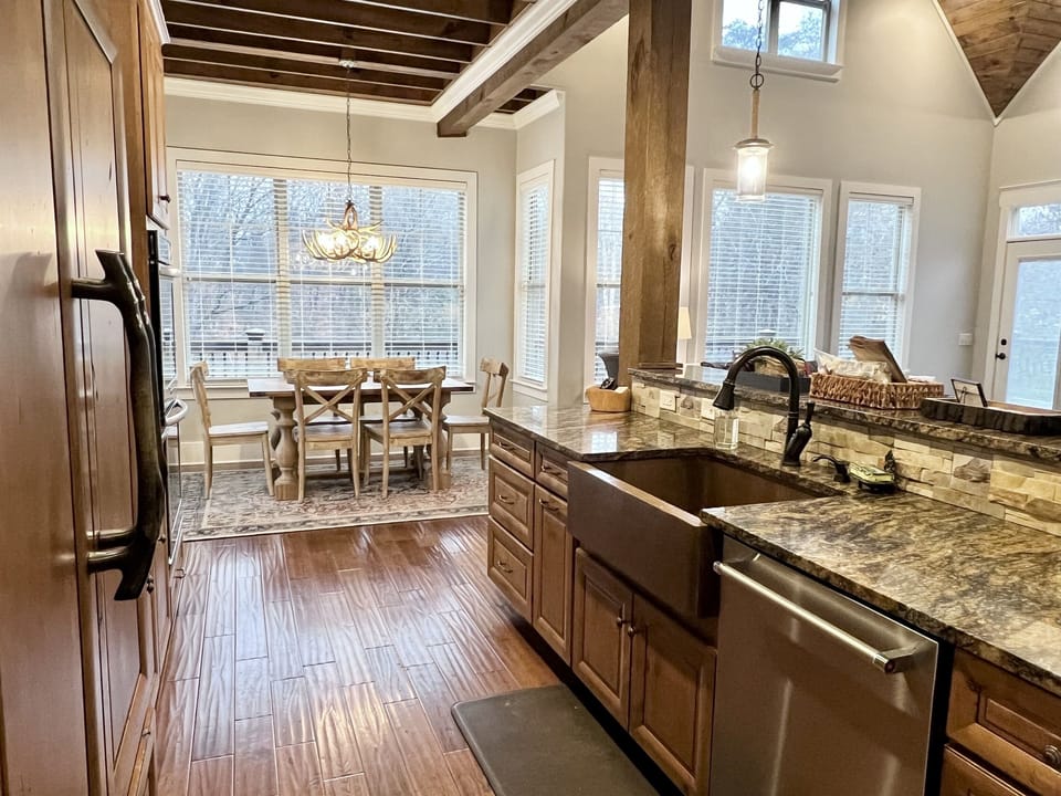 The open concept kitchen/dining and living room means there is room for everyone while the food is cooking and the game is on! 