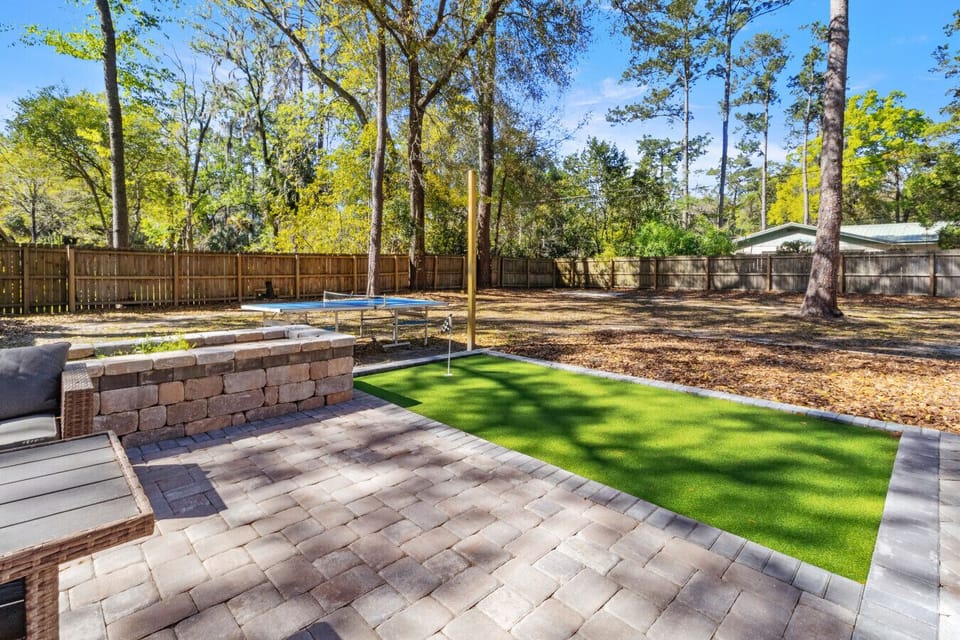 Backyard built for fun—putting course and fire pit vibes.