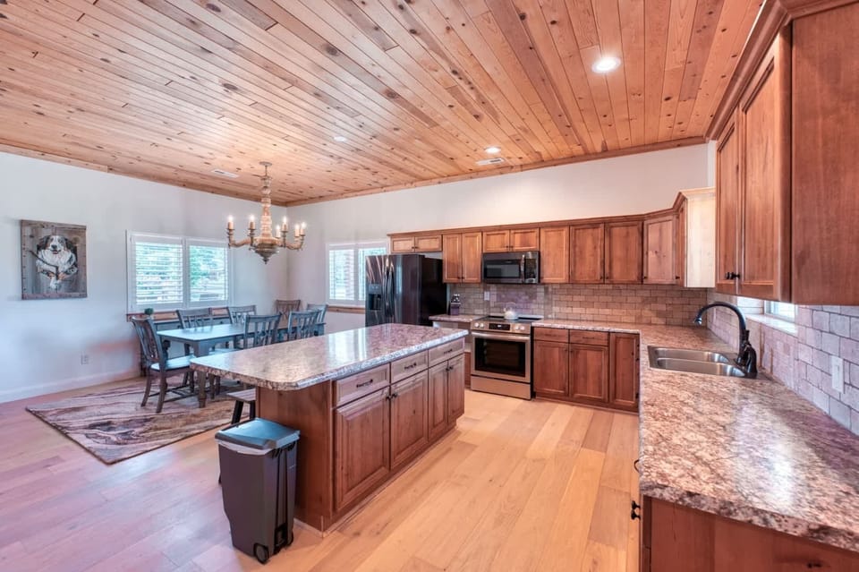 Gather and connect in our inviting open-concept space. The kitchen is a chef's dream, featuring premium appliances and plenty of room to cook and entertain.