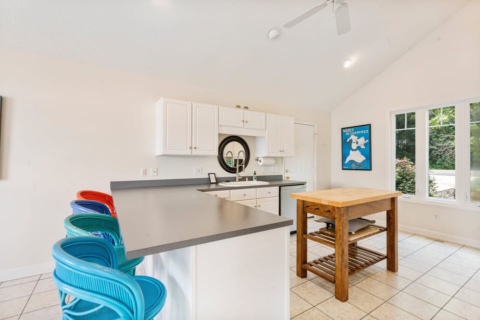 Fully stocked kitchen to prep all your group meals with island plus counter seating for 4.