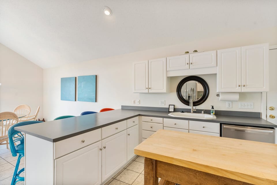 Fully stocked kitchen to prep all your group meals with island plus counter seating for 4.