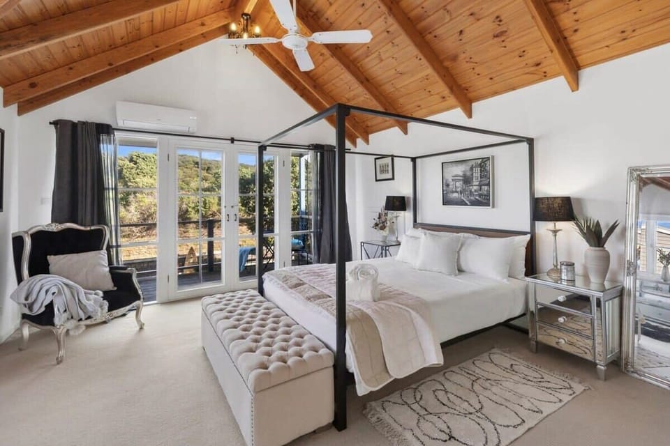 Master bed with canopy and private balcony. Wake up to the sound of the waves breaking on the beach, just over the sand dunes...