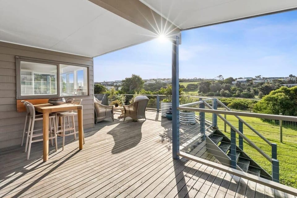 The expansive outdoor deck is sheltered and ideal for alfresco dining and enjoying the wetland views