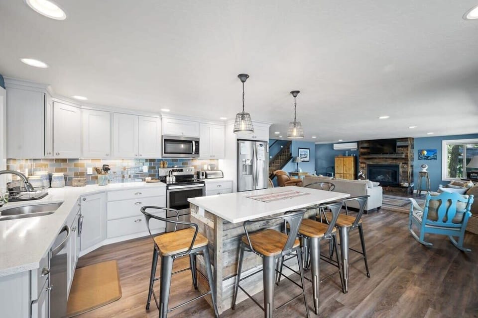 Step into your spacious open-concept kitchen where culinary adventures await. Modern appliances and island seating create the perfect gathering spot for memorable meals.