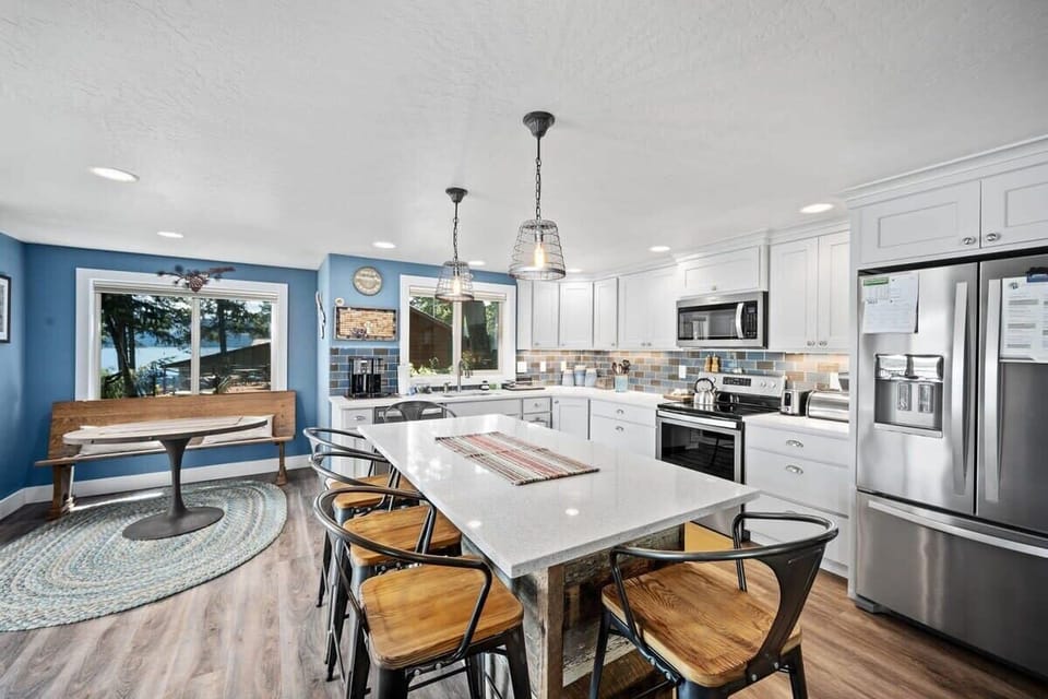 You'll love cooking in this bright, fully-equipped kitchen with modern appliances and a spacious island perfect for meals together.
