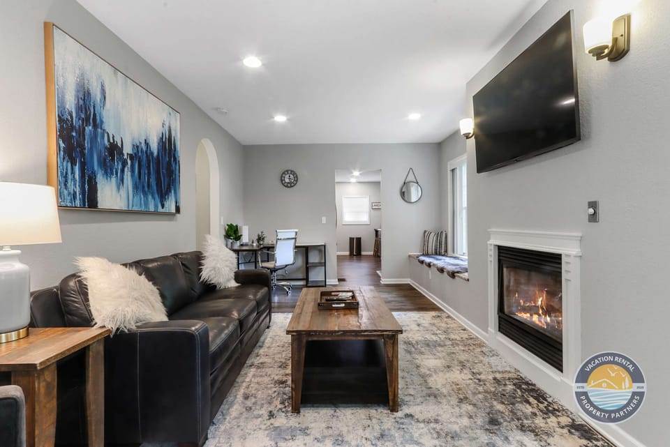 Welcome to your cozy, pet-friendly retreat just 5 minutes from the heart of Lake Geneva. This inviting living room features a plush sleeper sofa, fireplace, and comfortable seating, perfect for relaxing after cruising the lake or exploring downtown.