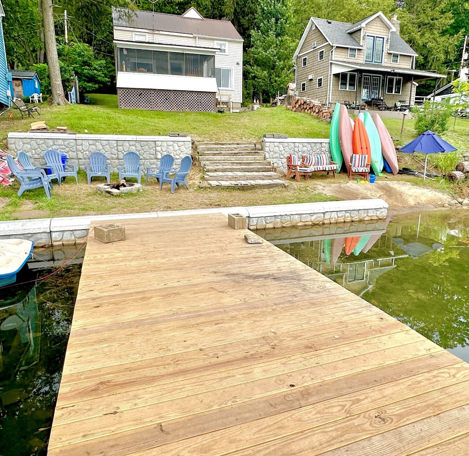 Enjoy 75 foot of lakefront with an expansive campfire area and a private beach. 