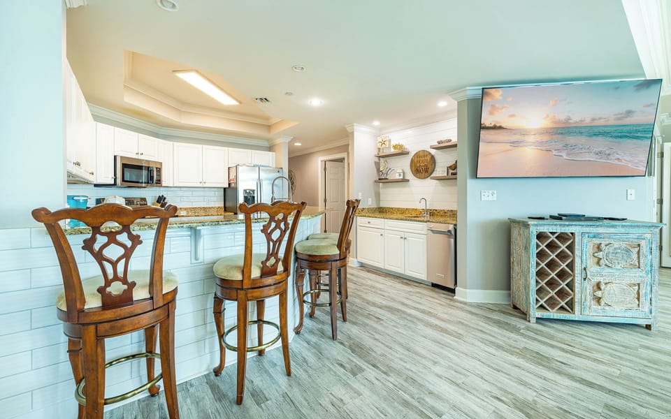 Imagine sharing laughs and snacks around the breakfast bar in this bright living room space
