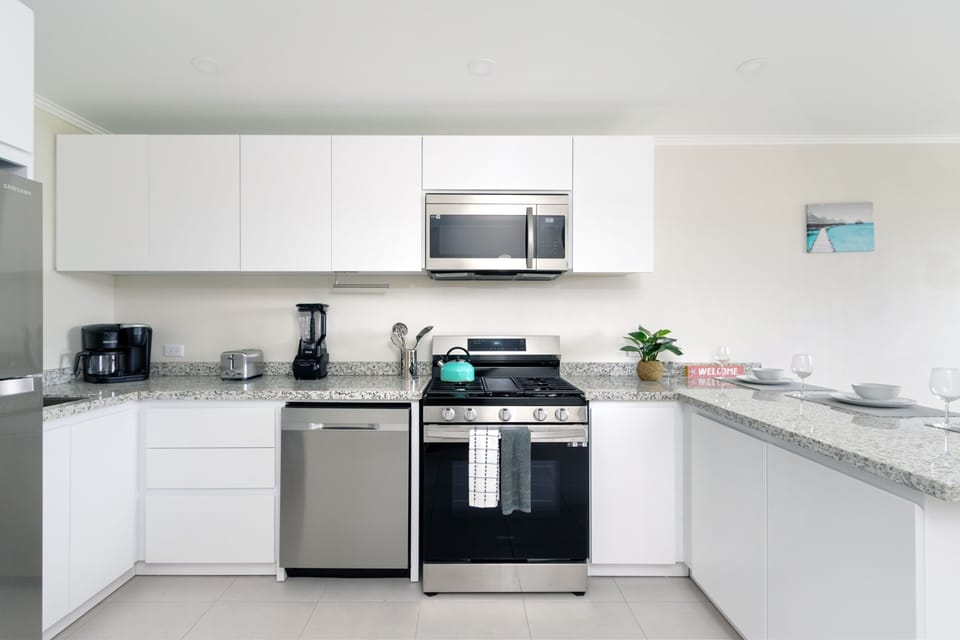 Enjoy the convenience and elegance of our fully furnished, modern kitchen.