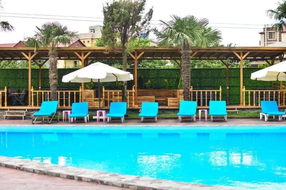 Outdoor pool, open 9:00 AM to 7:00 PM, pool umbrellas, sun loungers