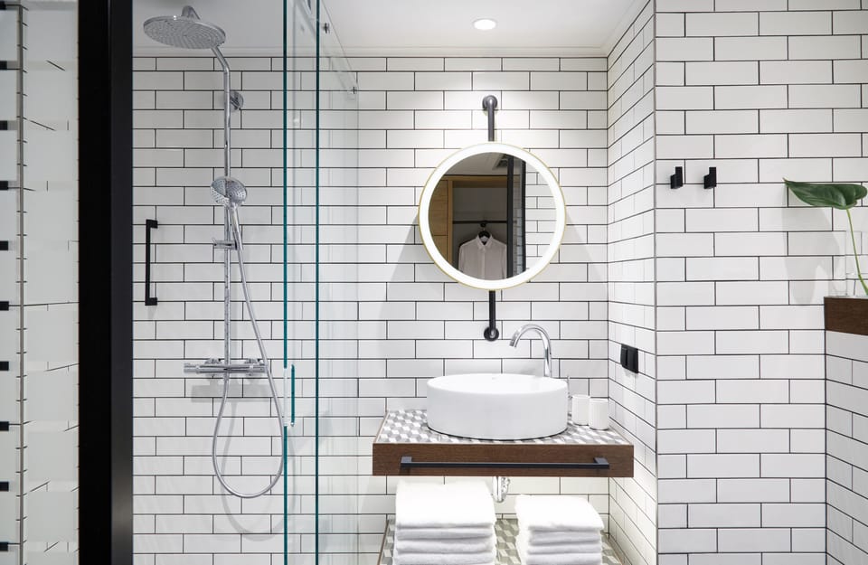 Shower, rainfall showerhead, hair dryer, towels