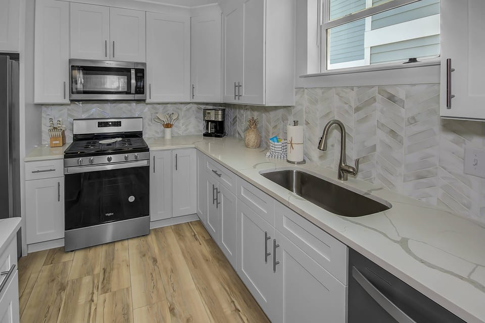 Well appointed kitchen offers beautiful quartz counter-tops, stainless appliances
