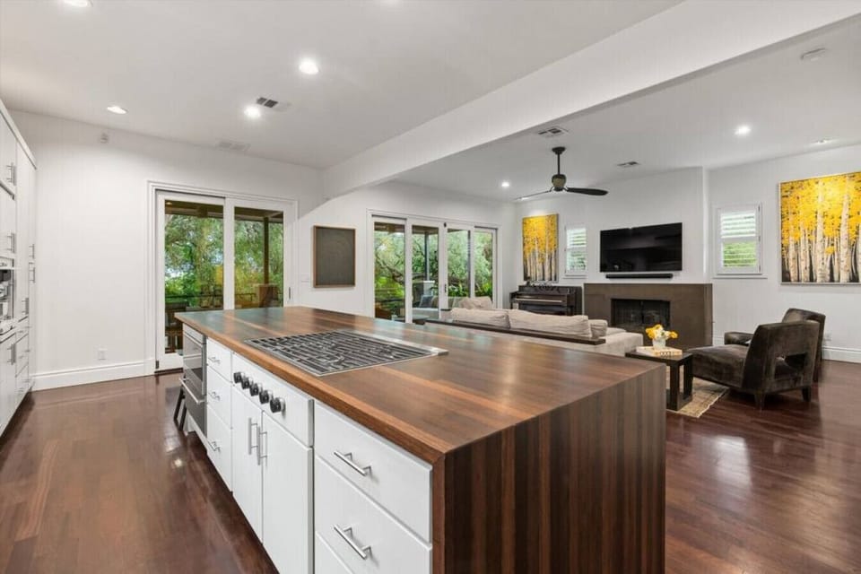 Chef`s Kitchen with commercial appliances and walks out to huge living and balcony!