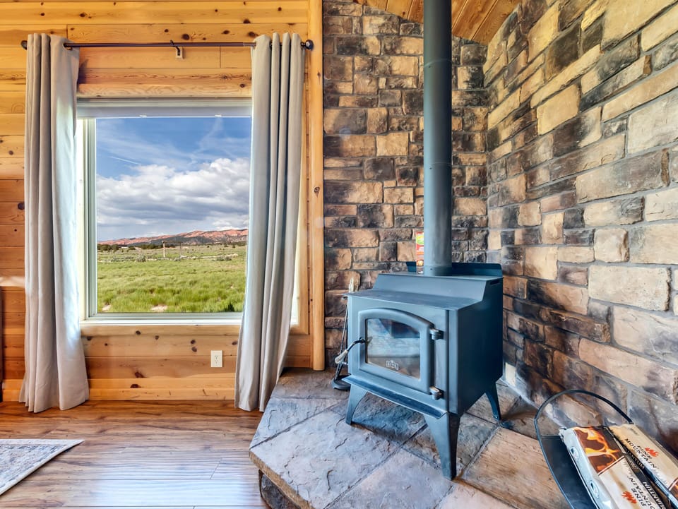 Living Room: Charming stone walls and stunning views invite you to unwind in style!