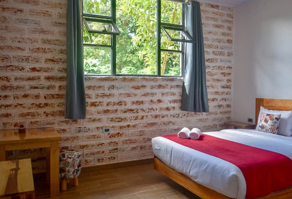 Deluxe Quadruple Room | Down comforters, WiFi (free), bed sheets